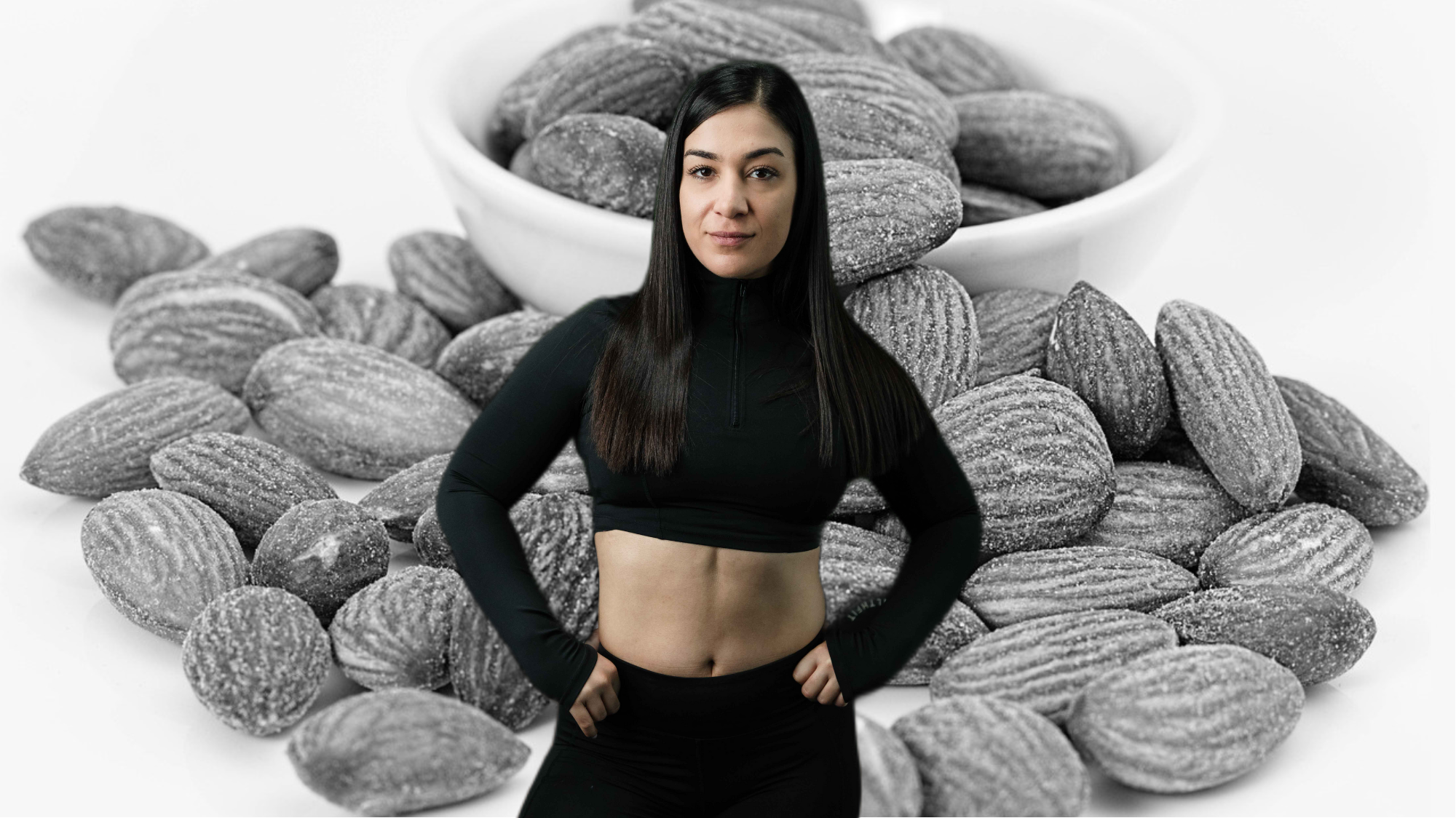 Immaġini ħajja u li tagħti s-saħħa ta' Miriam, nutrizzjonista u personal trainer ċertifikata f'Malta, wieqfa b'fiduċja f'ambjent modern ta' ġinnasju. Iżżomm skutella ta' frott u ħxejjex friski, li tissimbolizza nutrizzjoni bbilanċjata. Il-viżwali ta' madwarha jinkludu ikliet rikki fin-nutrijenti, protein shakes, u fliexken tal-ilma, li jenfasizzaw l-importanza tal-idratazzjoni u l-mili xieraq għat-taħriġ. L-imġiba professjonali u li toqrob ta' Miriam tirrifletti l-kompetenza tagħha fil-gwida tal-klijenti lejn il-ksib tal-għanijiet tal-fitness permezz ta' pjanijiet ta' nutrizzjoni personalizzati. L-immaġini tippromwovi l-messaġġ li nutrizzjoni xierqa hija essenzjali għat-telf tax-xaħam, il-bini tal-muskoli, u s-suċċess ġenerali tal-fitness.