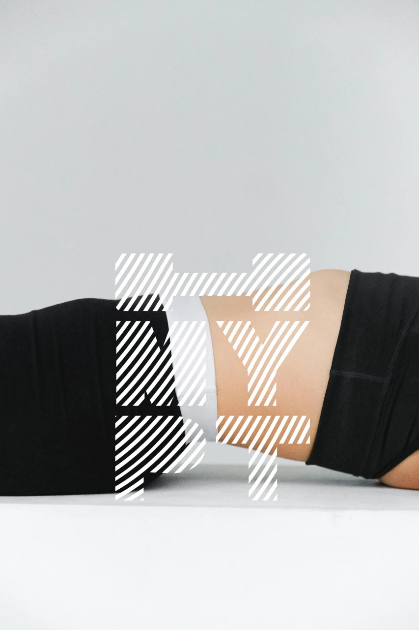 Flat stomach in athletic wear during core exercise – showcasing results of effective personal training and transverse abdominis engagement in Malta
