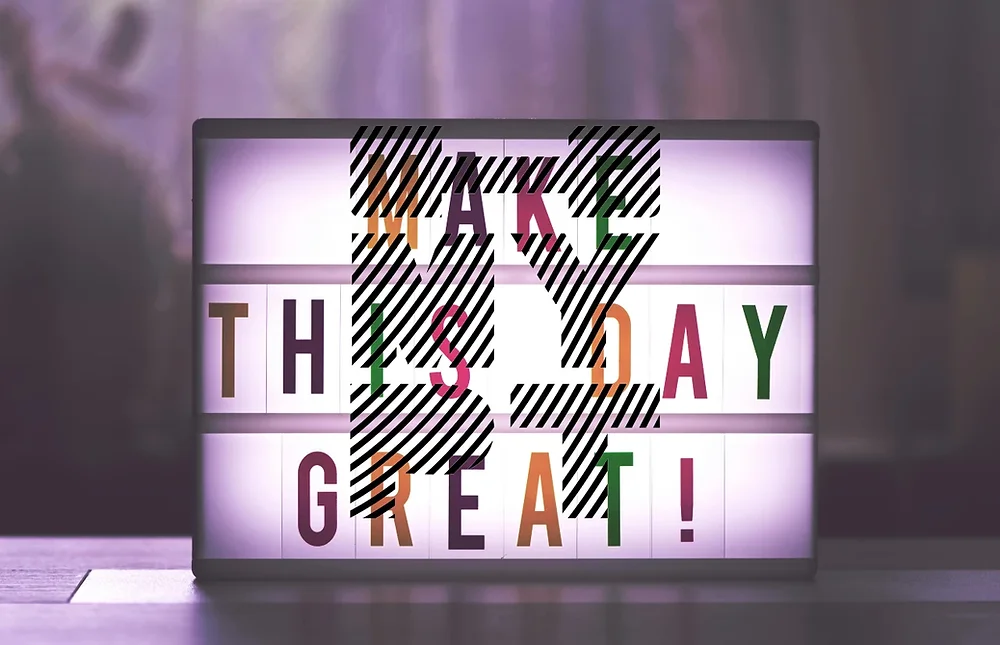 Illuminated sign displaying 'Make This Day Great!' in bold, colorful letters. A motivational message designed to inspire positivity and action, perfect for fitness enthusiasts and personal training in Malta.